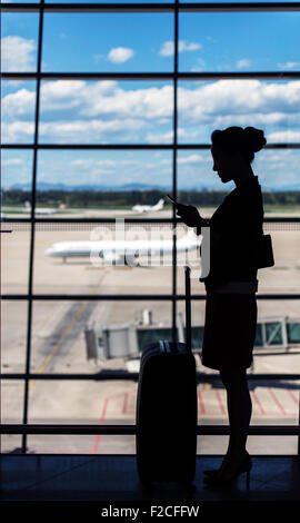 Businesswoman at Beijing Capital International Airport T3 Banque D'Images