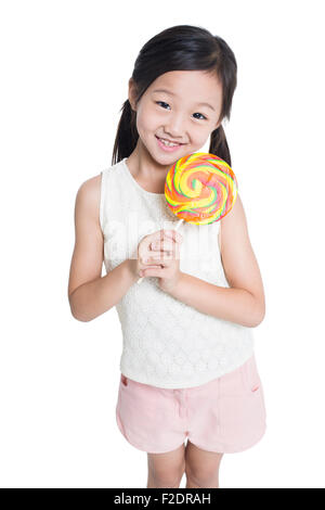 Happy girl with lollipop Banque D'Images