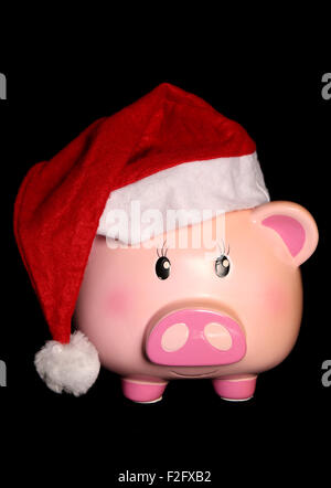 Piggy Bank wearing a santa hat dentelle Banque D'Images