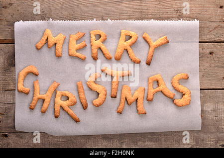 Sweet Joyeux Noël arrière-plan sur une vieille planche en bois Banque D'Images