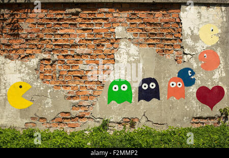 Vieux jeu d'arcade, peint sur un mur. Banque D'Images