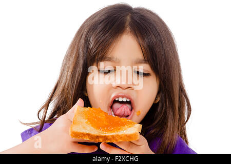 1 Indian kid girl eating Bread Banque D'Images