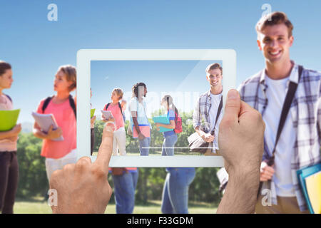 Image composite de hand holding tablet pc Banque D'Images