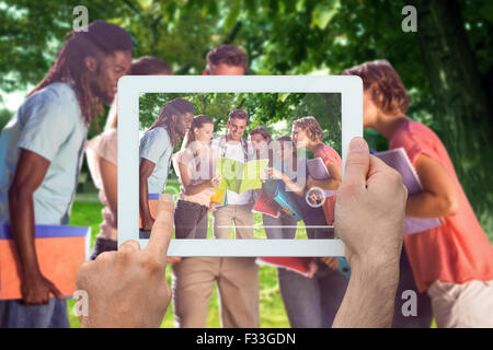 Image composite de hand holding tablet pc Banque D'Images