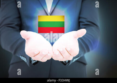 Composite image of businessman holding ses mains Banque D'Images