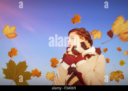 Composite image of woman in winter clothes Banque D'Images