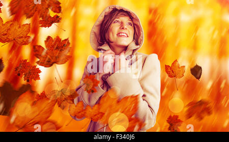 Portrait of Beautiful woman in winter coat looking up Banque D'Images