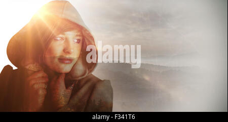 Image composite de belle femme porte manteau d'hiver à l'écart Banque D'Images