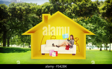 Image composite de woman lying on couch with shopping bags