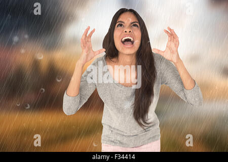Image composite de brunette en colère crier Banque D'Images