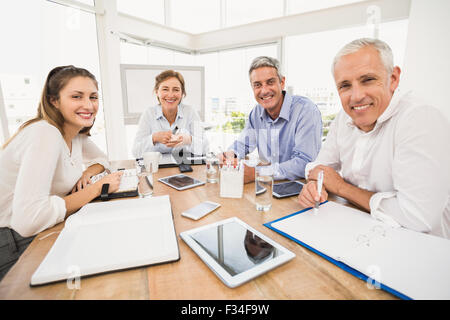 Smiling business people lors d'une réunion Banque D'Images