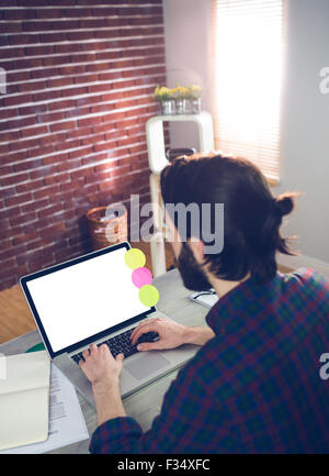 High angle view of creative editor using laptop Banque D'Images