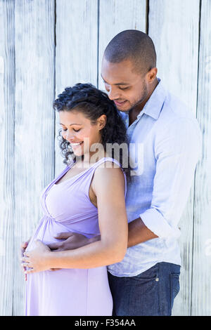 Happy pregnant woman touching belly Banque D'Images