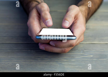 Portrait de personne holding mobile phone Banque D'Images