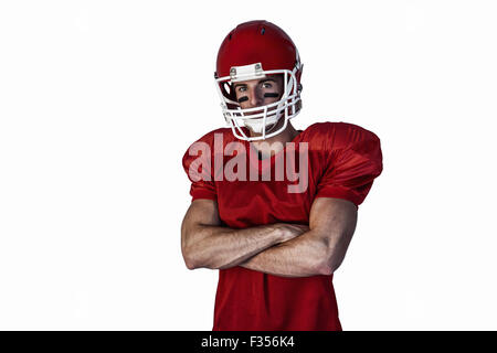 Portrait de joueur de rugby portant casque avec les bras croisés Banque D'Images