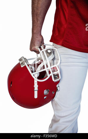 Portrait rugby player holding helmet Banque D'Images