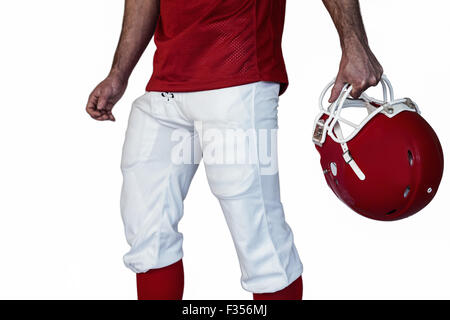 Au milieu du player holding rugby helmet Banque D'Images