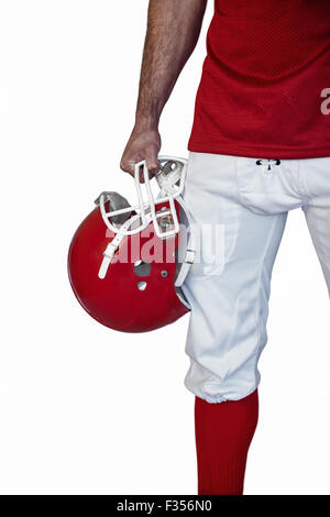 Portrait d'un joueur de rugby holding helmet Banque D'Images