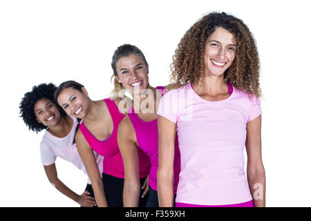 Portrait of smiling women standing in row Banque D'Images