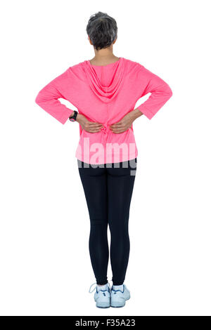 Woman in sportswear retour massage Banque D'Images