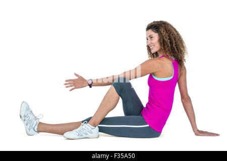 Vue latérale du young woman exercising Banque D'Images