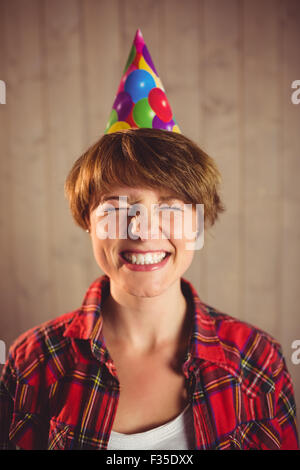 Attractive young woman wearing party hat Banque D'Images