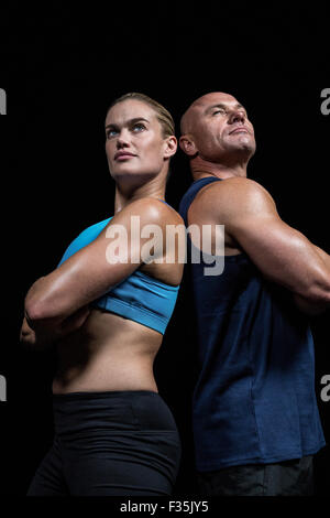 Low angle view of muscular man and woman Banque D'Images