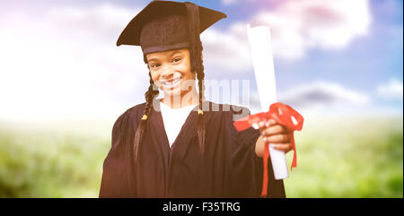 Image composite de l'élève in graduation robe mignon Banque D'Images