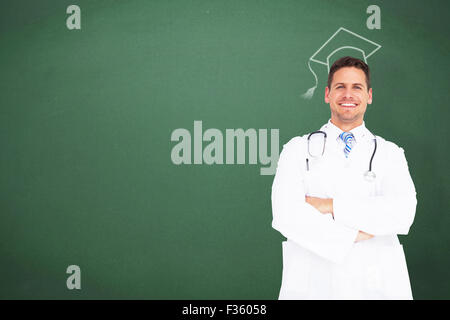 Image composite de handsome doctor with arms crossed Banque D'Images