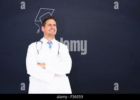 Image composite de handsome doctor with arms crossed Banque D'Images