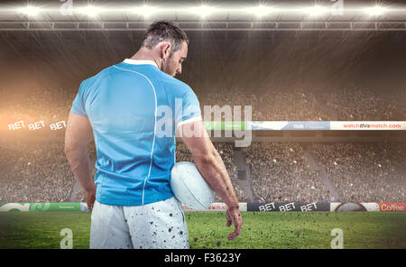 Image composite de rugby player with ball permanent Banque D'Images