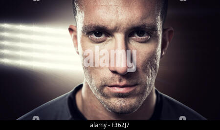 Image composite de close-up portrait of serious rugby player Banque D'Images