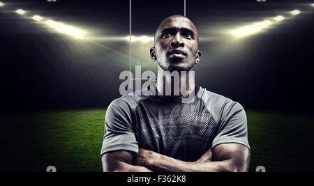 Composite image rugby player with arms crossed Banque D'Images