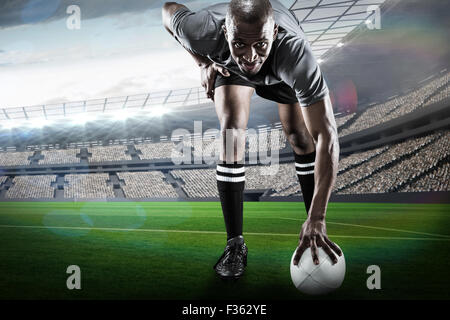 Composite image of rugby player smiling Banque D'Images