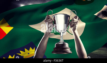 Image composite de rugby player holding trophy Banque D'Images