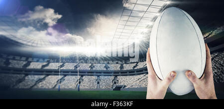 Image composite de rugby, attraper un ballon de rugby Banque D'Images