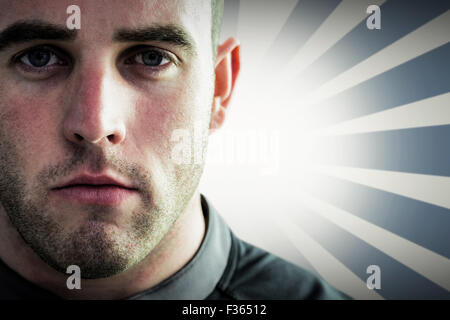 Image composite de difficiles rugby player looking at camera Banque D'Images