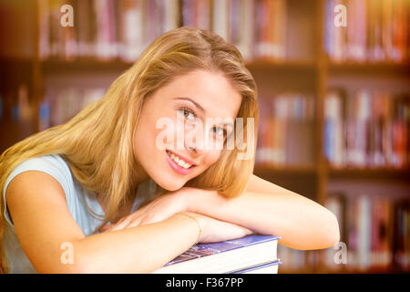 Image composite de portrait of female student in library Banque D'Images
