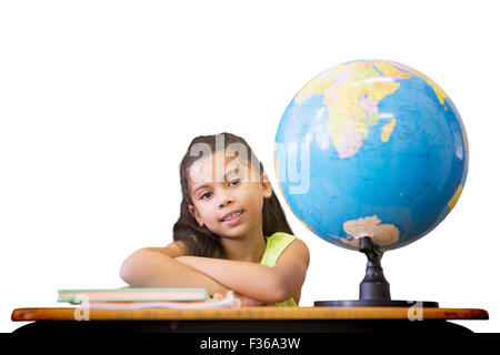 Image composite de cute pupils sitting at desk Banque D'Images