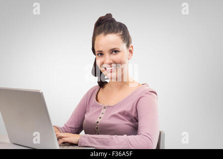 Image composite de l'élève sur ordinateur portable Banque D'Images