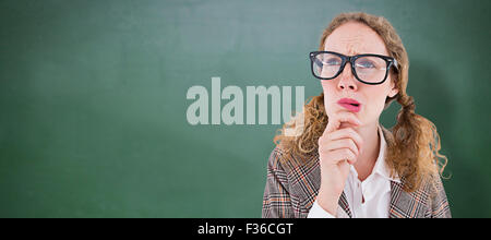 Image composite de hipster geek woman thinking with hand on chin Banque D'Images