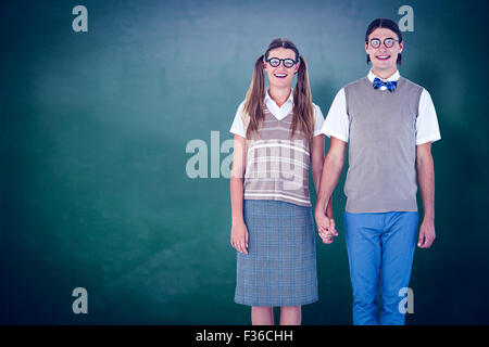 Image composite de hipster geek couple holding hands Banque D'Images