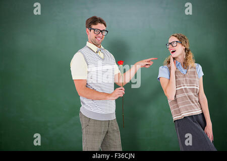 Image composite de hipster geek holding rose et vers son amie Banque D'Images