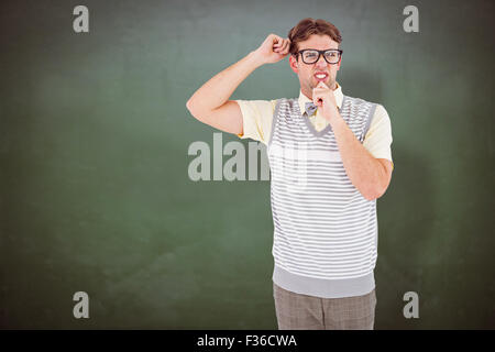 Image composite de hipster geek thinking with hand on chin Banque D'Images