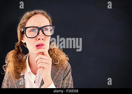 Image composite de hipster geek woman thinking with hand on chin Banque D'Images