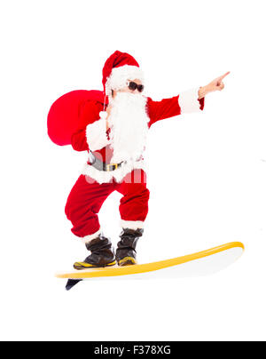 Happy Santa Claus surf avec surf board Banque D'Images