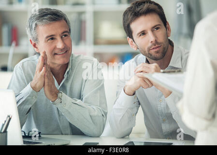 Colleagues talking in business meeting Banque D'Images