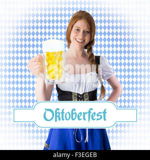 Image composite de l'Oktoberfest girl smiling at camera holding beer Banque D'Images