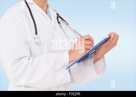 Image composite de doctor writing on clipboard Banque D'Images