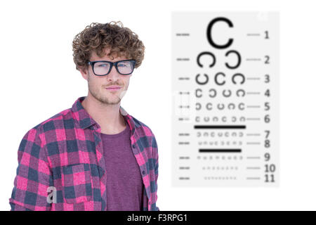 Image composite de bel homme portant des lunettes geek over white background Banque D'Images